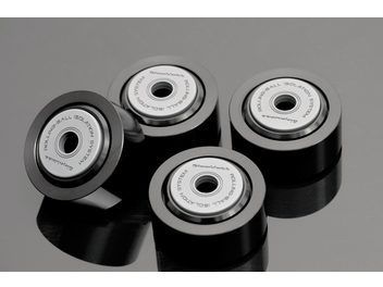 Four GigaWatt Rolling-Ball Isolation System vibration-damping feet, black cylinders with balls, product photo