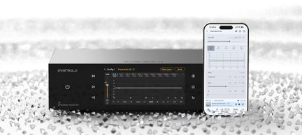 Black metal audio chassis, glass front panel, parametric equalizer display, front view, next to a smartphone