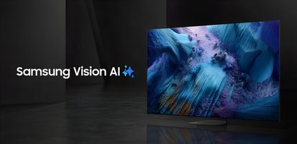 Téléviseur Samsung à cadre ultra-fin gris foncé, écran en verre lisse affichant un visuel abstrait bleuté, socle rectangulaire noir, vue trois‑quarts avant droit