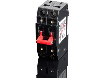 Two black GigaWatt G-16A 2P 16A wall outlets on DIN rail, red plugs, circuit breakers, matte plastic