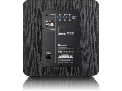 SVS SB-2000 Pro black ash subwoofer, rear view showing connections and controls, front view on dark wood background