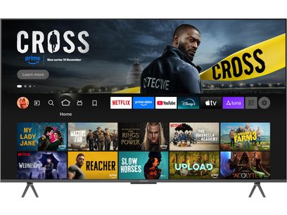 Telewizor wysokiej rozdzielczości Panasonic TV-85W95BEG w kolorze czarnym z cienką plastikową ramką i szarymi metalowymi nóżkami, ekran włączony wyświetlający interfejs usług streamingowych, widok z przodu