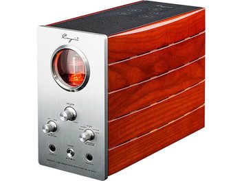 Cayin HA-1A MK2 high-fidelity headphone preamplifier in three-quarter front view, rectangular cabinet in red mahogany lacquered wood, brushed aluminum front panel with circular window revealing an orange-glowing tube, three knurled rotary knobs, two headphone jacks, and a black textured top surface