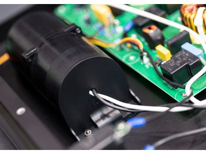 Audioquest PowerQuest 707 power conditioner open, top view, green printed circuit boards and electronic components visible