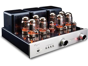 Cayin CS-100A KT88 silver stereo tube integrated amplifier, three-quarter front view, silver brushed aluminum front panel with two large cylindrical knobs and central selectors, black metal chassis topped with three black transformers and twelve glowing glass tubes