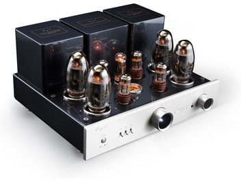 Cayin CS-150A silver tube stereo amplifier, black metal chassis and brushed aluminum front panel, three-quarter front left view, showing three black transformers at the rear, eight glowing vacuum tubes on the top plate, and two large cylindrical knobs along with small switches on the front panel