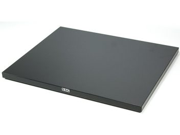 Black Flatbase vibration damper by SSC, matte black rectangular plate with white SSC logo, top view