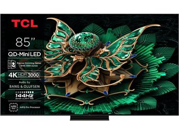 Téléviseur haute définition TCL 85C7K noir à cadre fin métallique avec pied central discret, écran plat 85 pouces affichant une illustration vert émeraude et texte technique sur la gauche, vue de face