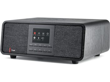 Pinell Supersound 501 bordradio i mørkegråt træ med sort børstet metalfront, højttalergitre i antracitstof på hver side af et farvedisplay over en række knapper, set fra trekvart forfra