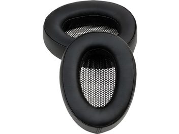 Pair of Meze Audio black leather pads, oval-shaped with a smooth outer surface and honeycomb-patterned inner grille, shown in a close-up, slightly top-down view