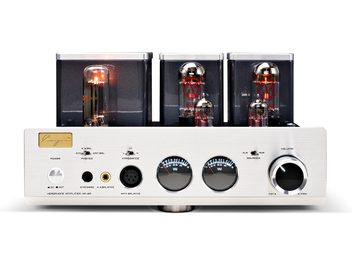 Cayin HA-3A high-fidelity headphone preamplifier in brushed aluminum silver, front view with three vacuum tubes under rear metal covers, two centrally backlit circular VU meters, large volume knob on the right, and multiple headphone jacks on the left