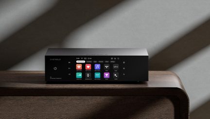 EverSolo matte black metal network player, front color display with music app icons, three-quarter front view