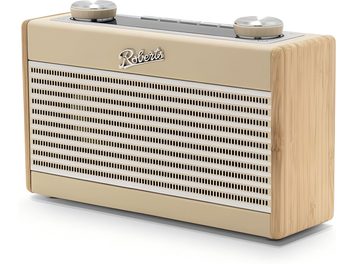 Radio de birou Roberts Rambler Uno în nuanțe bej și crem, cu fața frontală din metal perforat cu fante orizontale, flancuri din lemn deschis cu textură vizibilă, două butoane rotative mari argintii pe partea superioară, vedere din trei sferturi față