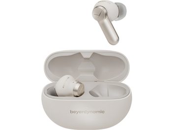 Slightly angled view of a set of Beyerdynamic Amiron 100 cream-colored matte beige plastic Bluetooth in-ear headphones, with an open matching oval case showing one earpiece inside and a second earpiece positioned above.