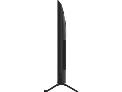 Τηλεόραση υψηλής ευκρίνειας Panasonic TV-55W95BEG μαύρη από υφασμένο πλαστικό, με λεπτό πάνελ ελαφρώς κυρτό στο πίσω μέρος όταν κοιτάζεται από το πλάι, τοποθετημένη σε κεντρικό πόδι σε σχήμα V