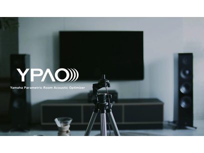 Front view of Yamaha R-N1000A black stereo hi-fi amplifier, tripod with YPAO microphone for acoustic calibration