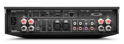 Rectangular black metal case, rear view, equipped with a power socket, transparent speaker terminals with red markers, and multiple HDMI, USB, coaxial, optical, XLR, RCA, Ethernet, and RS-232 ports