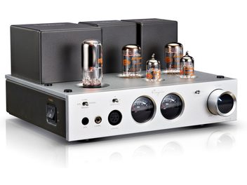 Cayin HA-2A headphone preamplifier with a metallic build, silver aluminum front panel, and anthracite gray casing, shown in a front-left perspective view, featuring four glass vacuum tubes on top, two round VU meters, multiple headphone jacks on the front, and a large volume knob