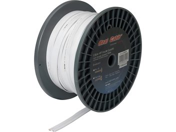 Bobine de câble blanc enroulé sur un support noir circulaire, étiquette rouge "Real Cable" au centre de la bobine