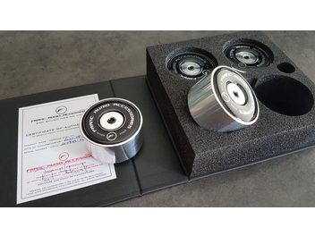 Four Ceramic Disc TH Franc Audio Accessories with certificate of authenticity on black foam cut-out background
