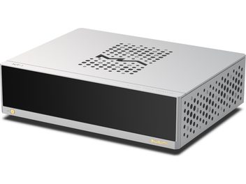 Matrix Audio NT‑1 digital transport in silver-grey aluminum, three-quarter front right view, smooth black glass front panel with a single gold power button at the bottom left, gold "MA" logo on the right, right side and top perforated with circular grilles featuring a central wavy pattern