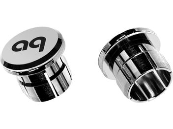 Two shiny chrome-plated metal noise-dampening Audioquest caps, cylindrical in shape with the "aq" logo engraved on top