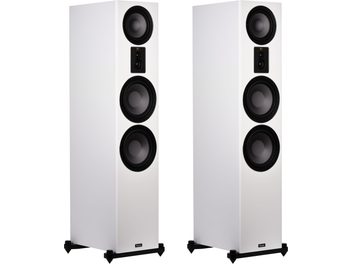 Enceintes colonne Signature 809 blanc satin, vue de face, 2 unités, 4 haut-parleurs circulaires noirs, socles noirs avec pointes