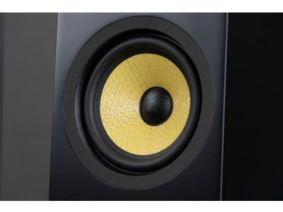 Davis Acoustics Courbet No. 4 Floorstanding Speaker in Matte Black, close-up view of a circular driver with a textured yellow cone.